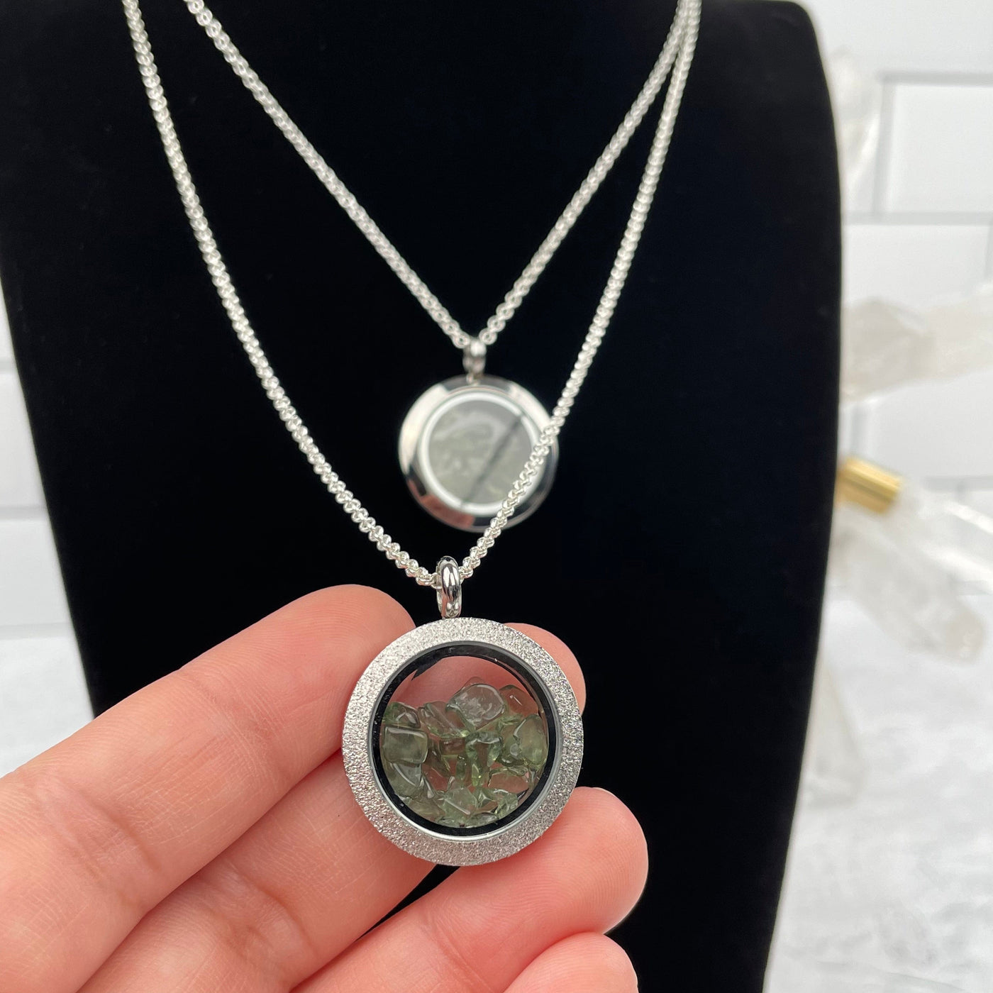 Moldavite Necklace in hand for size reference 