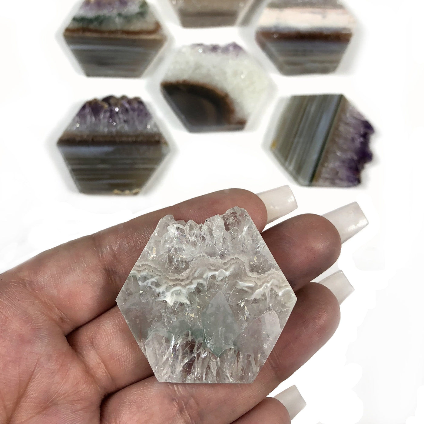 medium hexagon displayed in hand for size reference