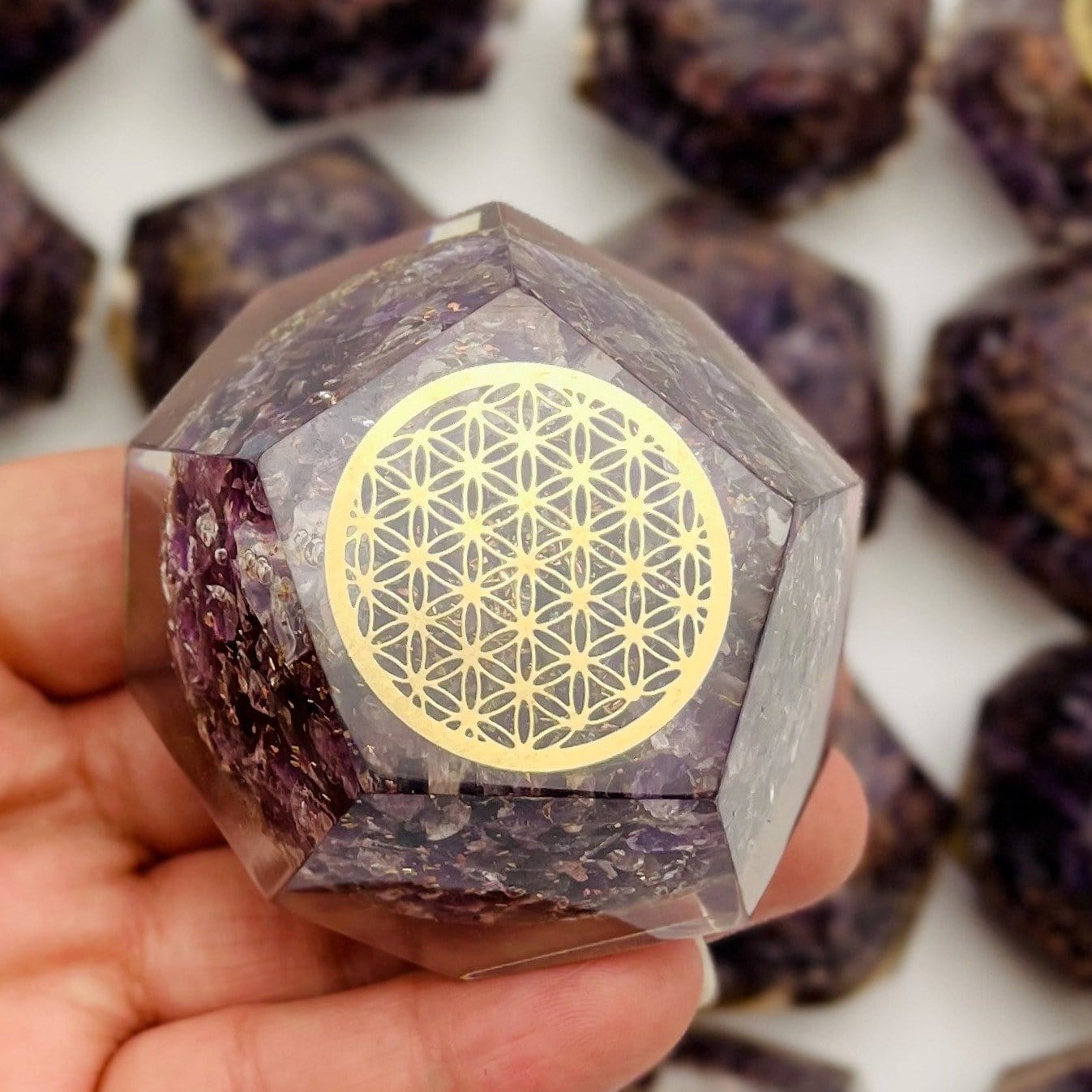 Orgone  in Dodecahedron shape Amethyst with Gold Flower of Life Grid in a hand for size reference