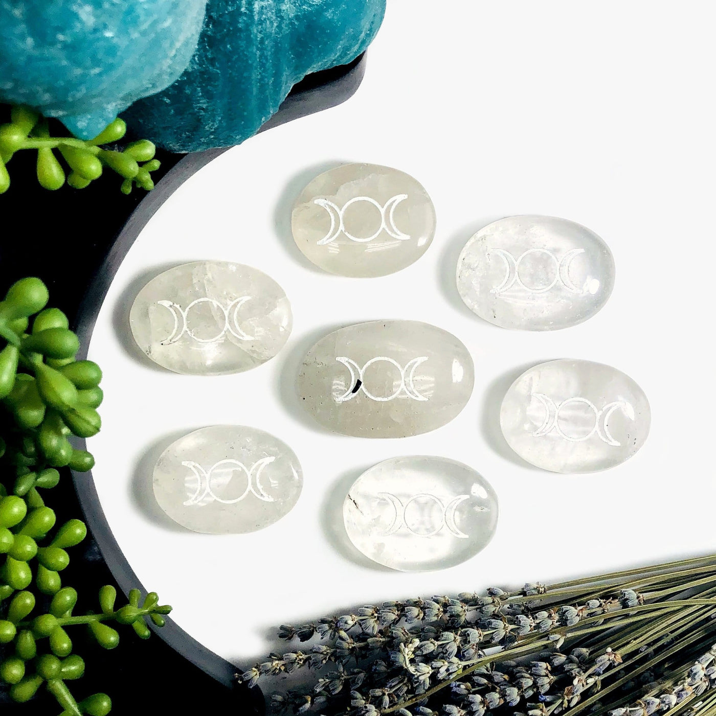 Multiple Crystal Quartz Palm Stones Pocket Stones with Moon Phase in white background