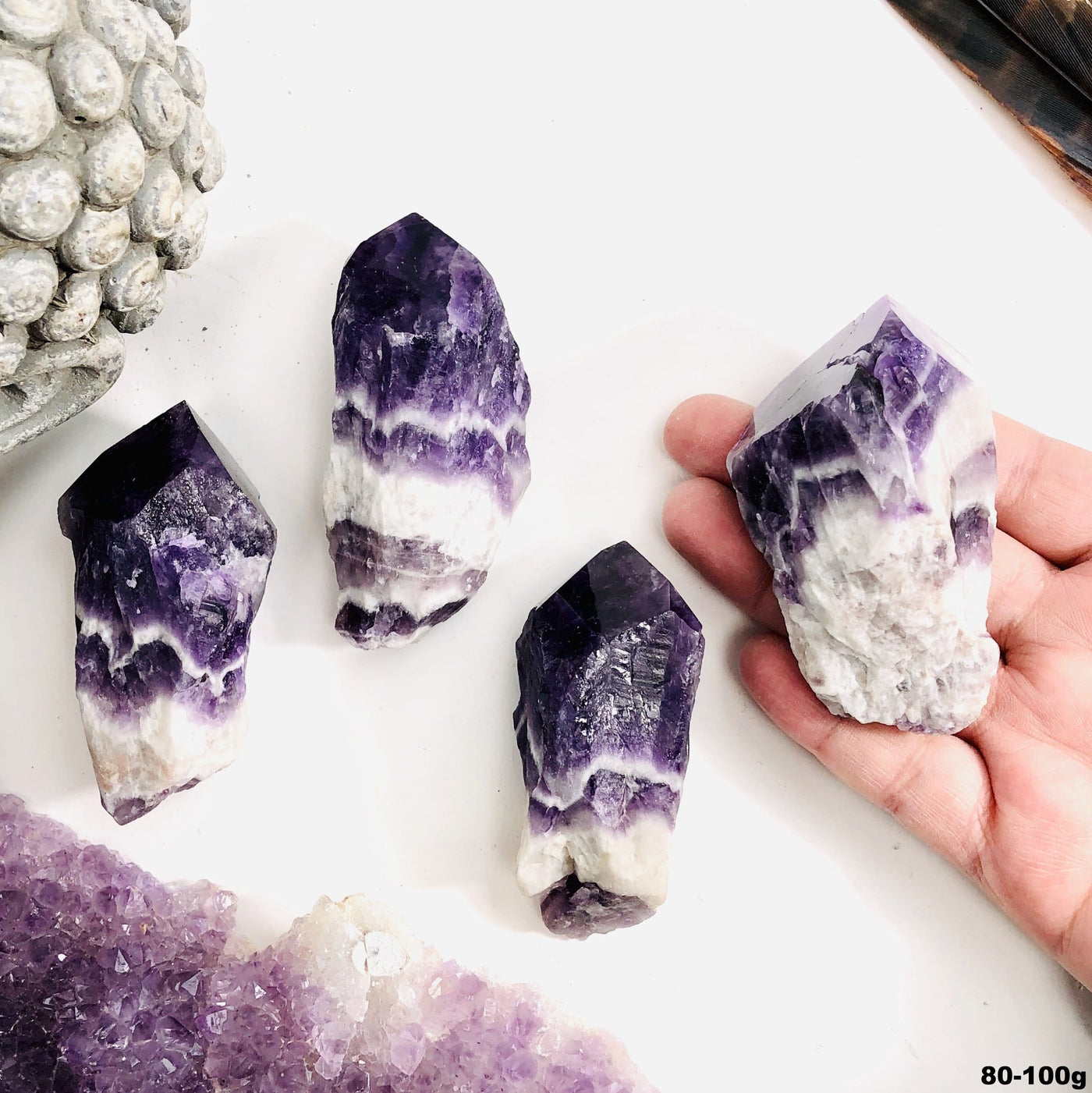 Four amethyst chevron points are being displayed on a white back ground. 