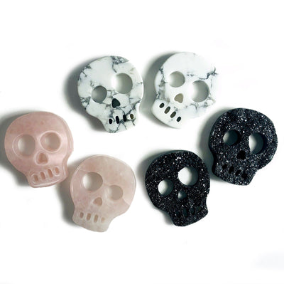 Gemstone Skull Cabochons  - 6 on a table