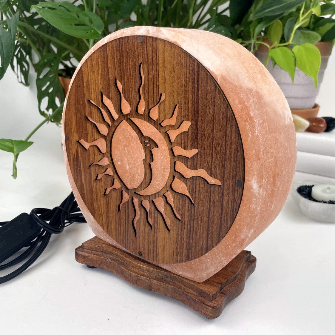 Himalayan salt lamp with sun moon design upside down sold as is from a side view