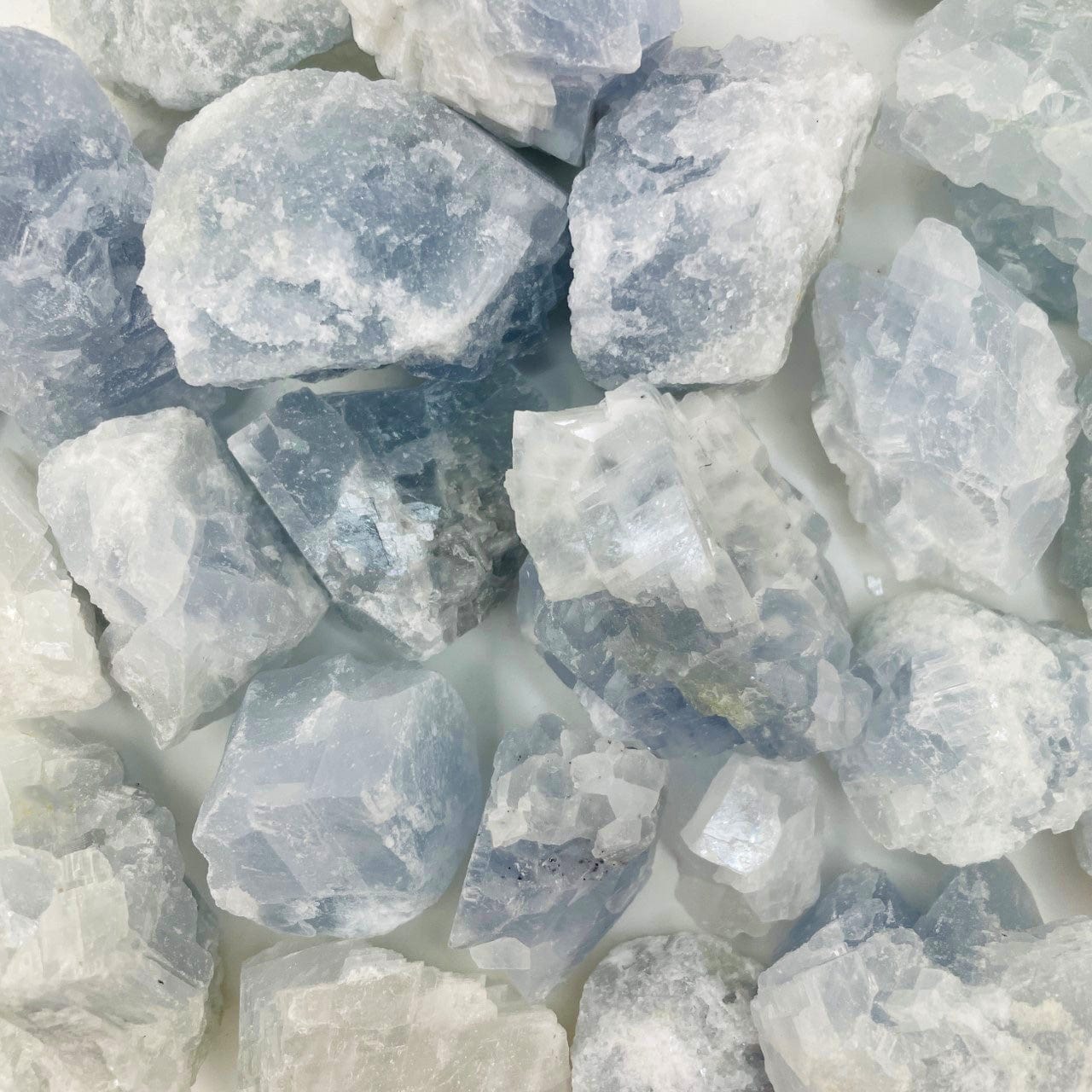 Celestite Stones on a table showing beautiful blue colora