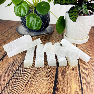 close up of selenite sticks on a table