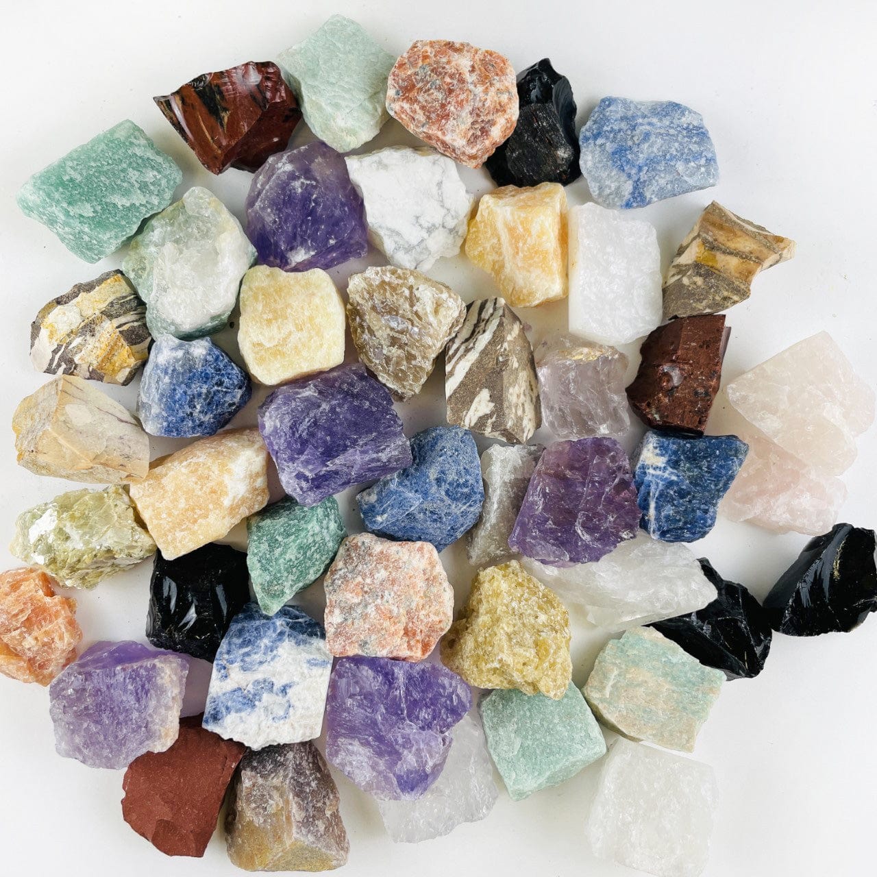 Assorted Mixed Gemstones in a pile on a table