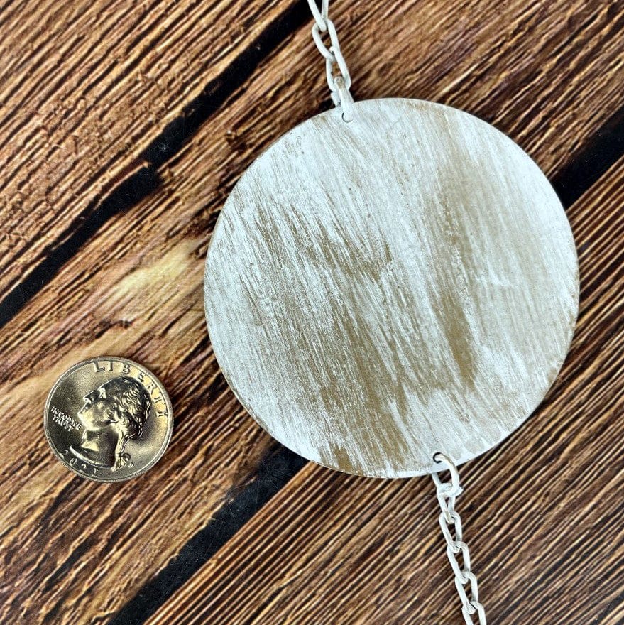Moon Phase Wall Hanging - Brushed Metal - Golden and White Finish close up with coin for size