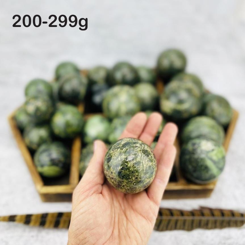  Nephrite Polished Spheres in hand for size reference weight 200-299g