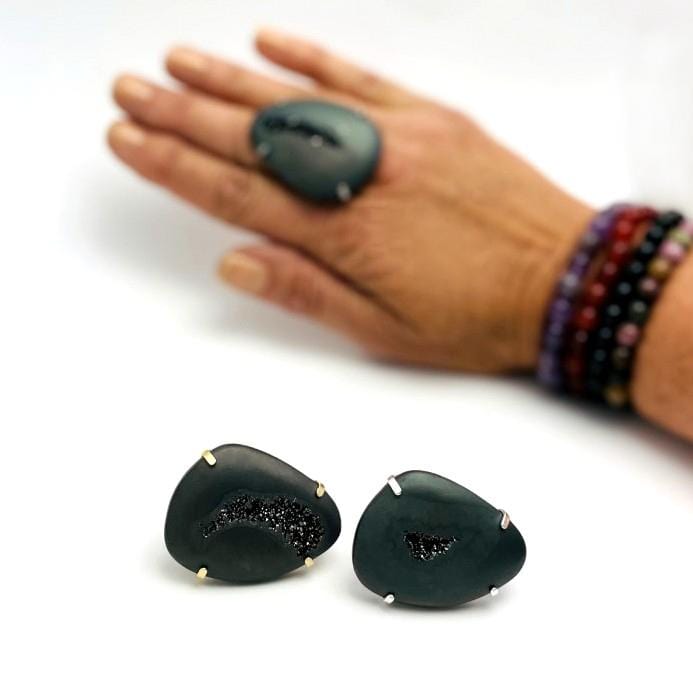 Large black druzy with titanium coating on an adjustable ring in gold or silver plated.  Pictured here is two rings on a white background and one on a woman's finger.
