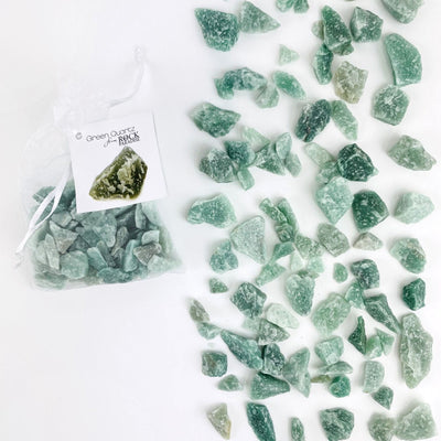 Green Quartz Stones - Tied & Tagged in an Organza Bag next to some spread out on table