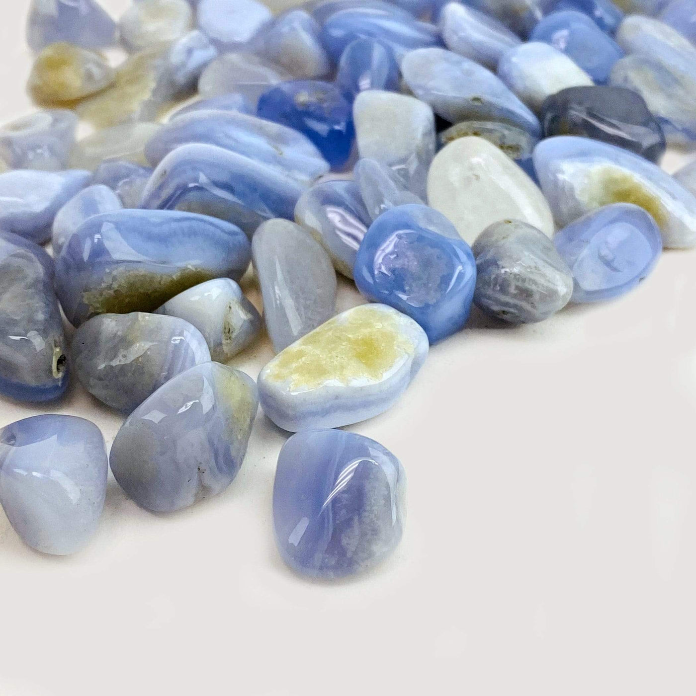 Blue Lace Agate Small Tumbled Stones spread out from a side view showing another angle