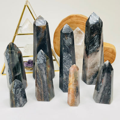 multiple hematite points displayed to show the differences in the sizes and color shades 