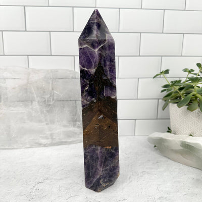 Chevron Amethyst Polished Point - side view showing thickness