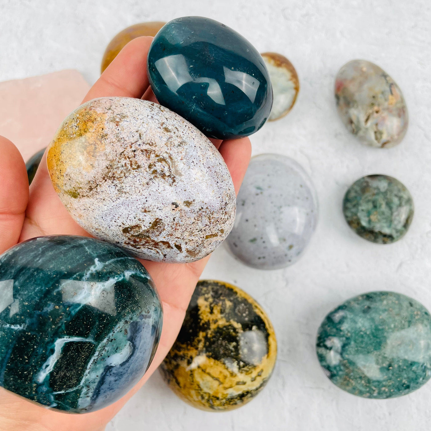 Ocean Jasper Palm Stones in hand for size reference 