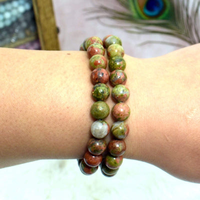 2 Unakite Round Bead Bracelets on wrist for size reference 