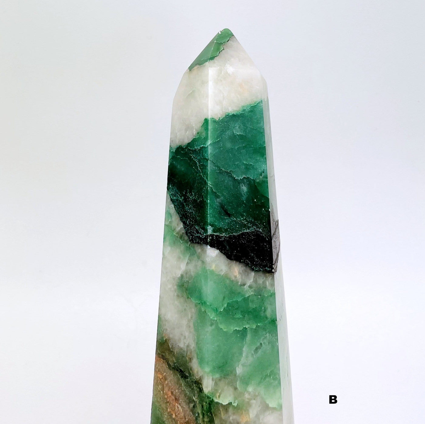 up close shot of tip of Green and White Quartz Polished Point