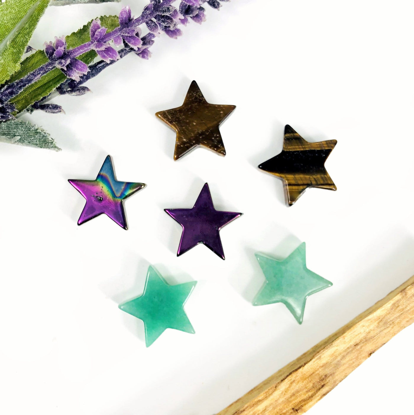 6 different Star Gemstone Cabochons displayed on white surface
