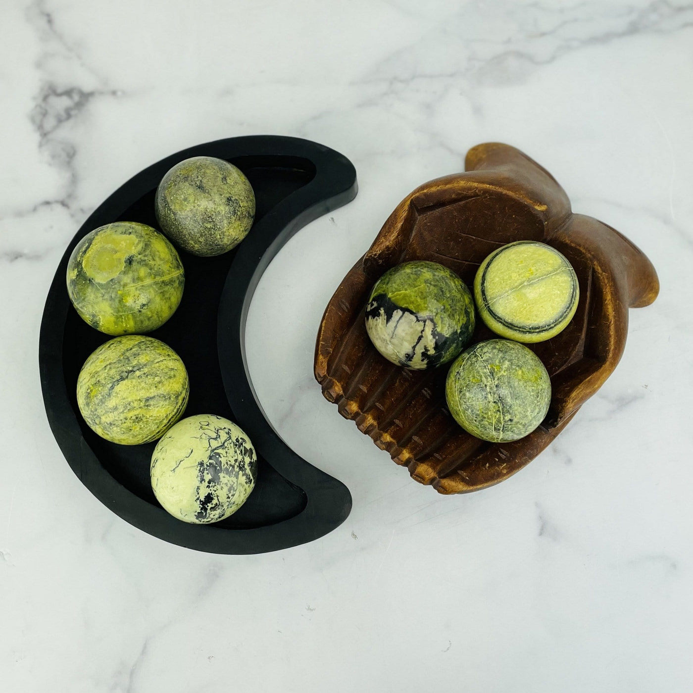 overhead view of 400g-600g serpentine polished spheres in wooden moon bowl and wooden hand bowl for possible variations