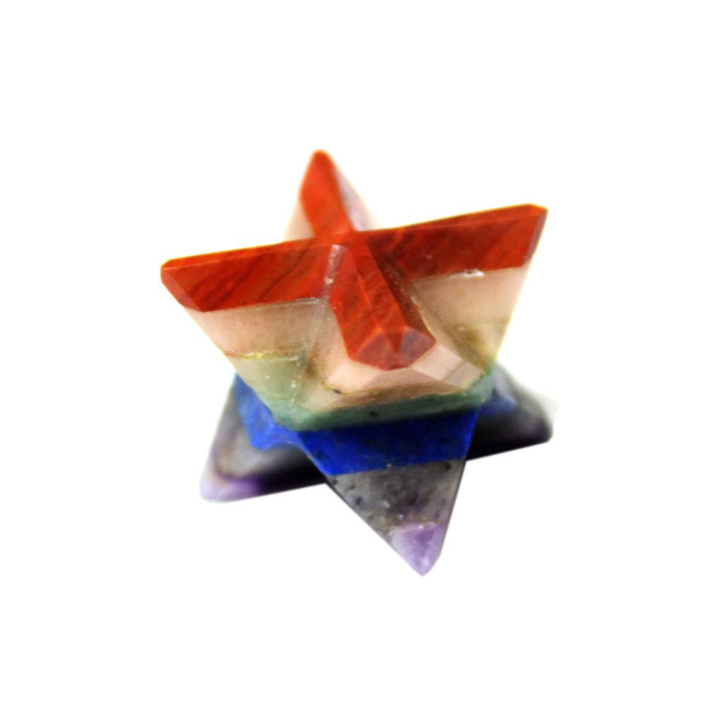 One merkaba star with Red Jasper, Amethyst, Green Adventurine, Lapis Lazuli, , Orange Adventurine, Yellow Calcite and other rainbow gemstones on a white background.