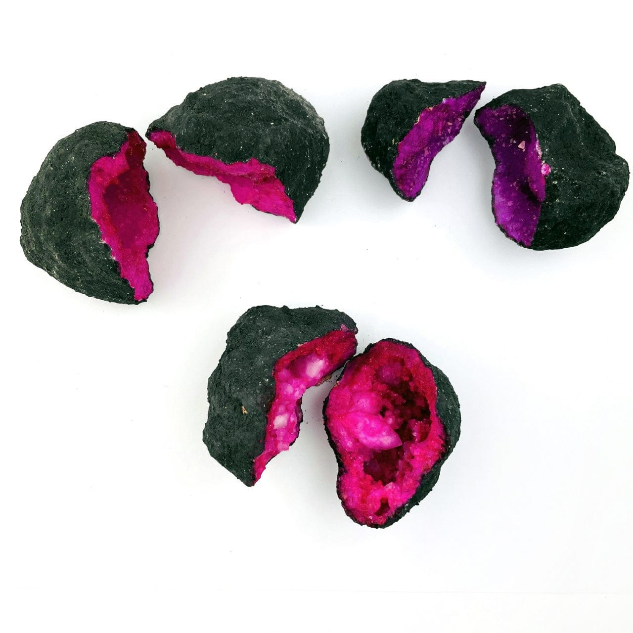 Hot3  Pink Color Dyed opened Geodes on a table shot from above