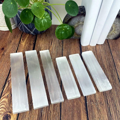 selenite bars on display for size comparison