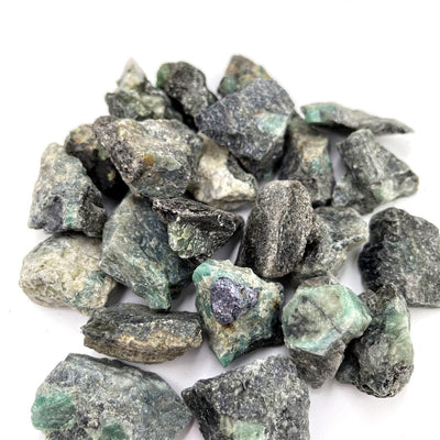 Emerald Natural Stones in a pile view from the side