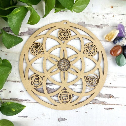 round wooden seed of life grid with chakras 