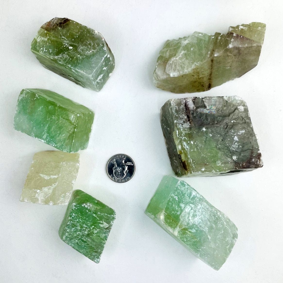 Green Calcite Stones with a quarter for size