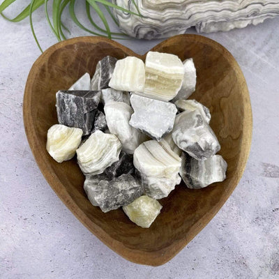 Mexican onyx stones displayed in a heart shape bowl bowl (not included).