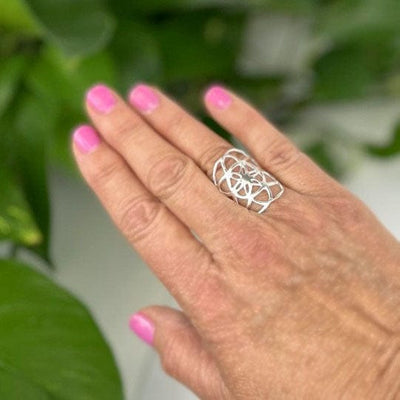 Seed of Life Ring in silver on a hand for size reference