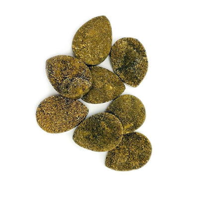 top view of gold titanium teardrop druzy cabochons on white background