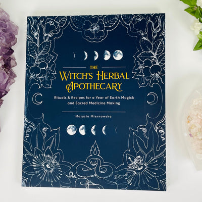 front cover of the witch's herbal apothecary book by marysia miernowska 