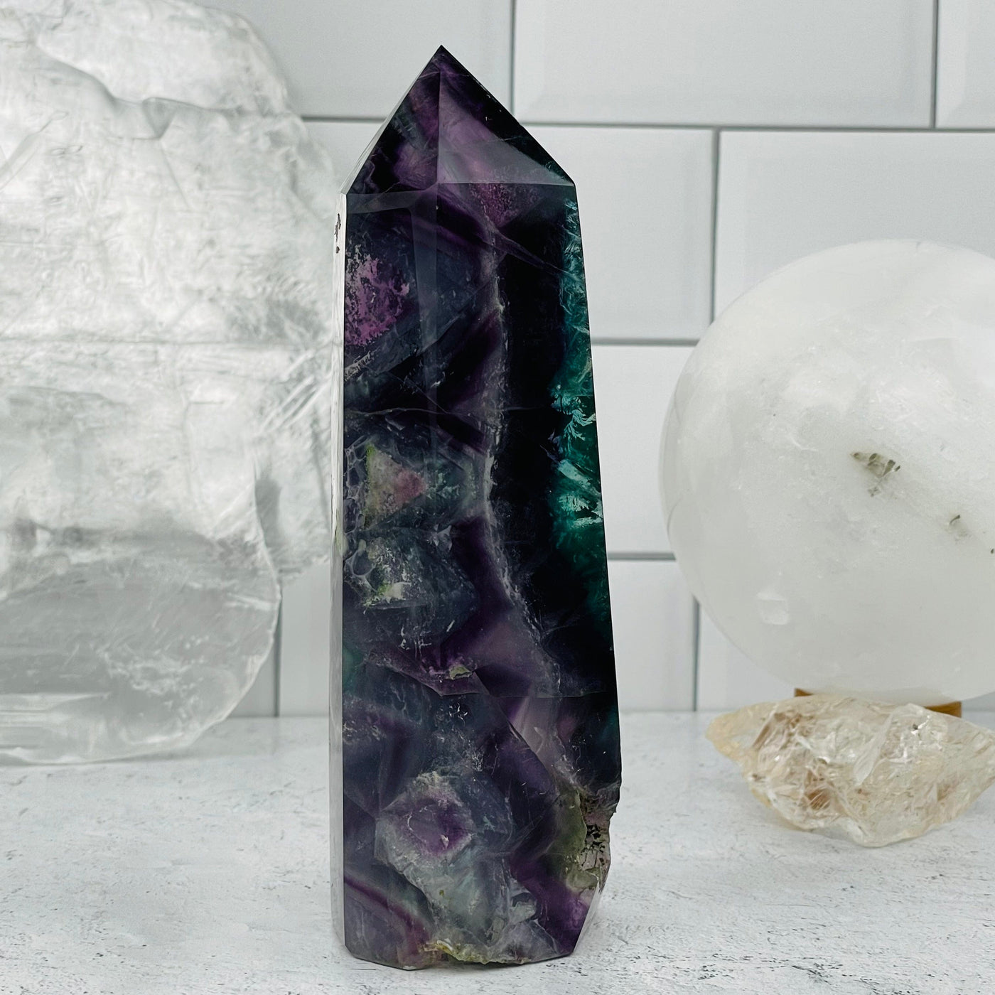Rainbow Fluorite Polished Point Tower displayed as home decor 