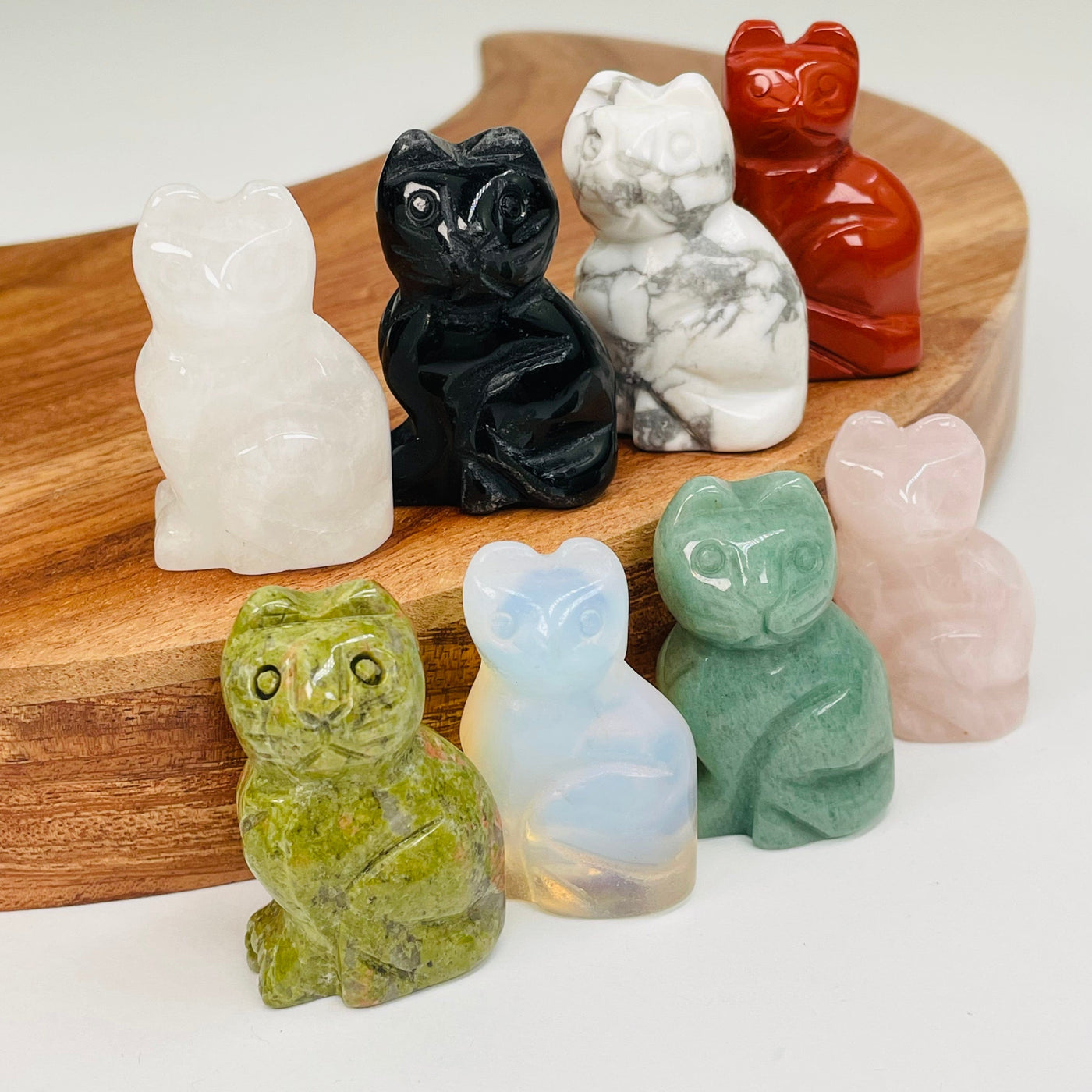multiple gemstone cats displayed to show the differences in the crystal types 