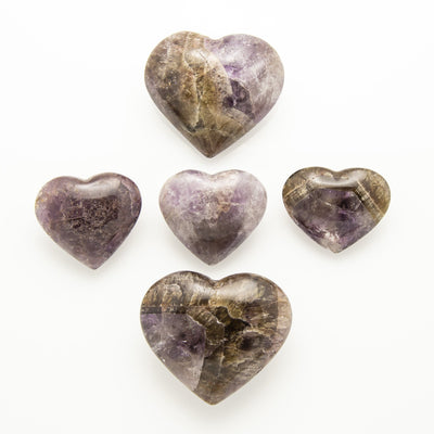 two different sizes of seven mineral stone heart on a white background
