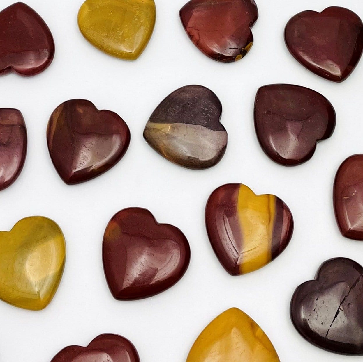 Mookaite Hearts scattered on white background
