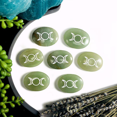 Multiple Green Aventurine Palm Stones Pocket Stones with Moon Phase in white background