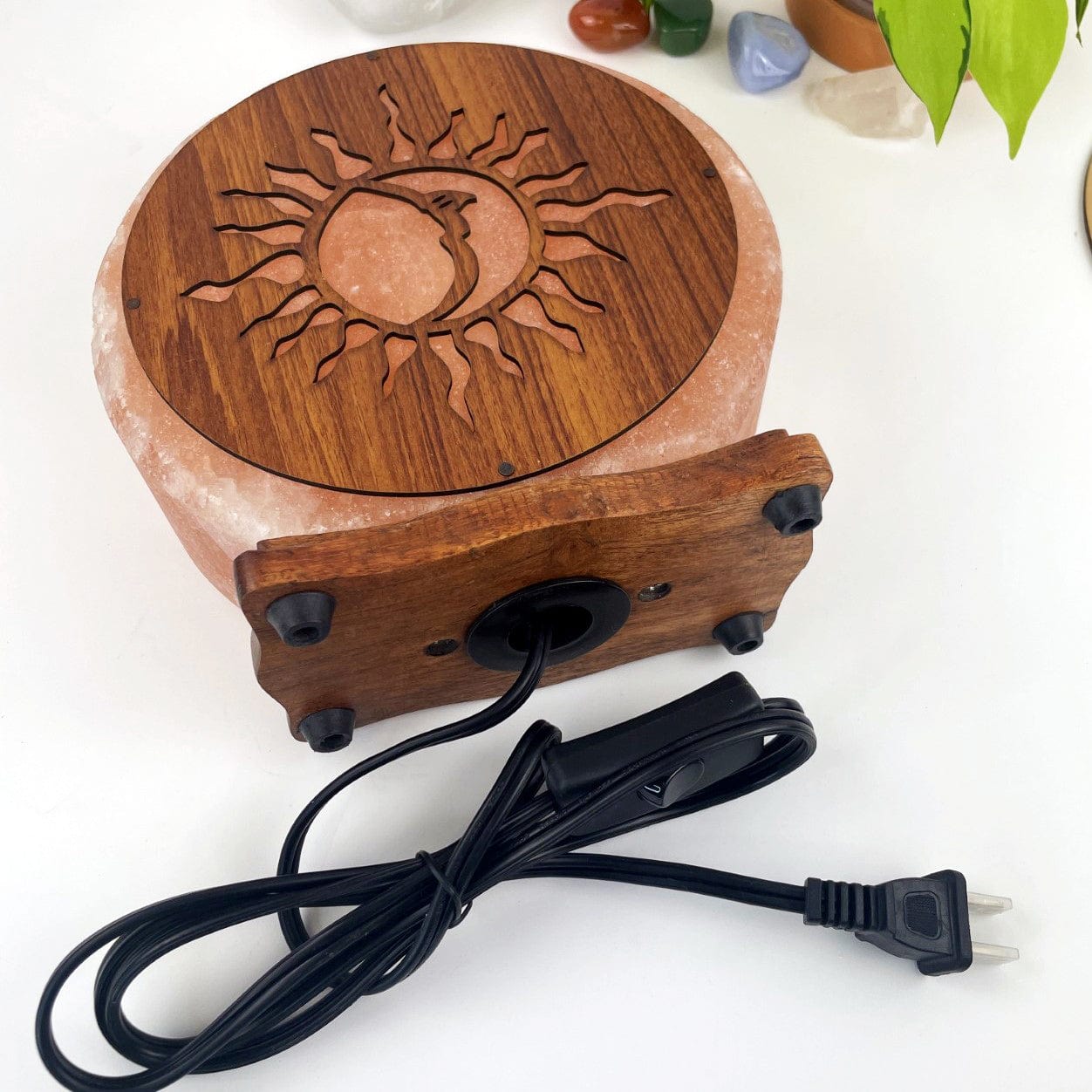 Himalayan salt lamp with sun moon design upside down sold as is , showing cord from bottom