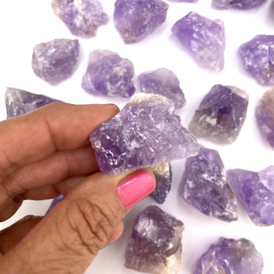 Amethyst Natural Stone in a hand for size
