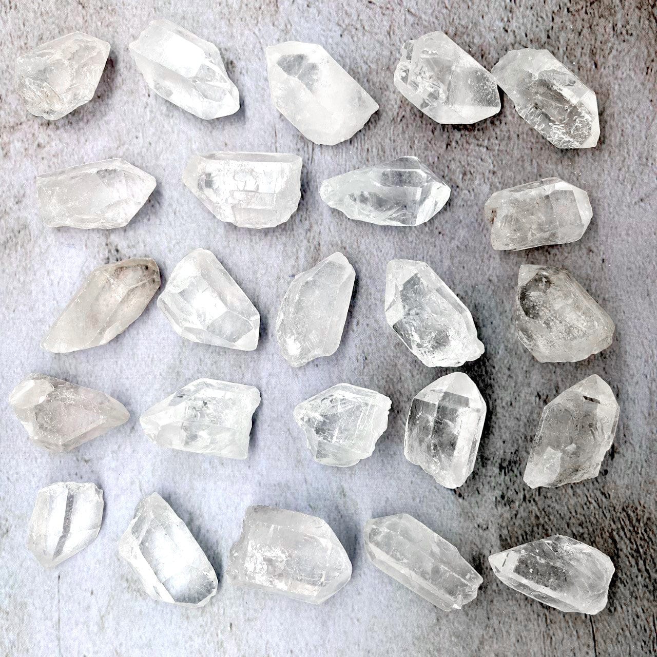 Crystal Quartz Natural Stone Points laid out on a table