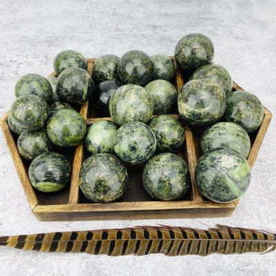  Nephrite Polished Spheres displayed with various weights to show color and size variations