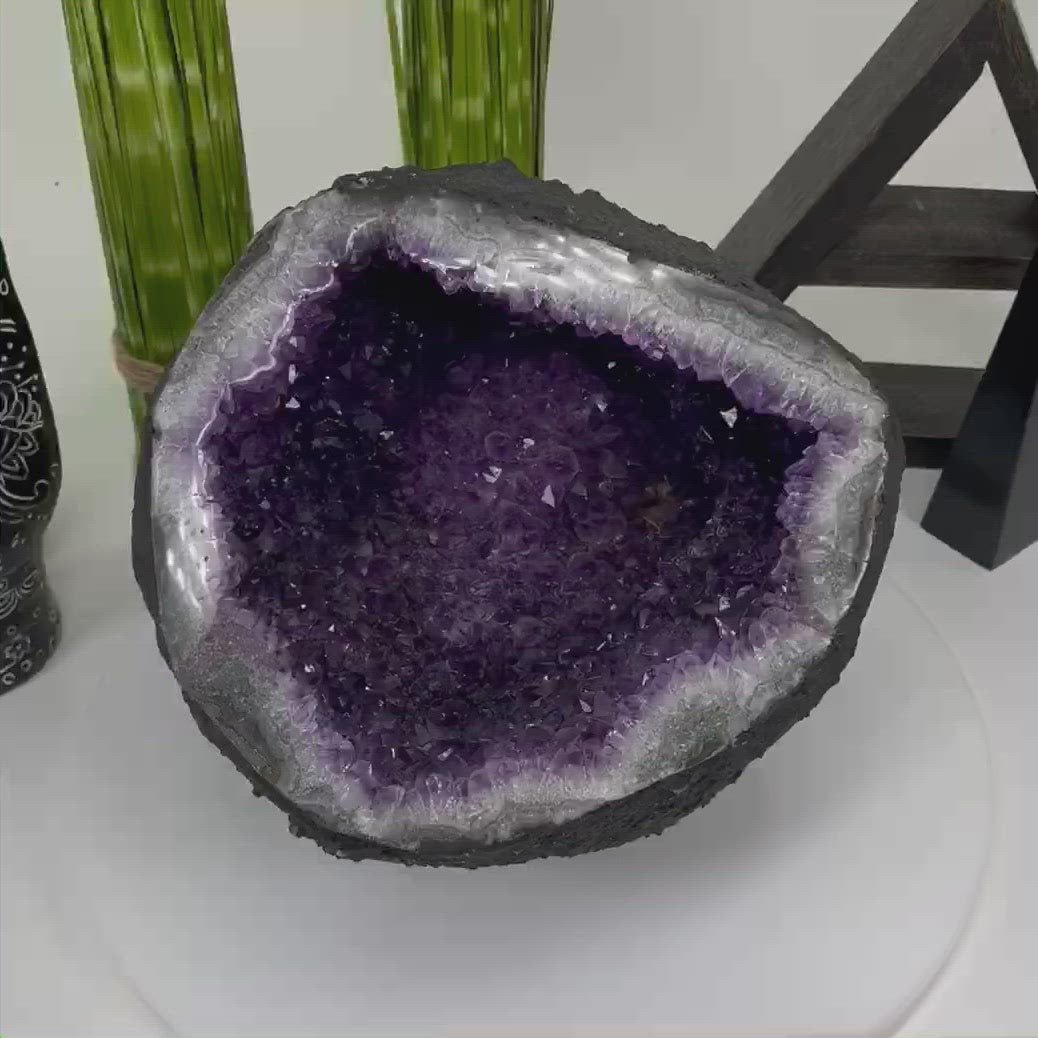 amethyst round cave geode spinning on platform for 360 view