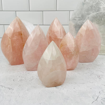 Rose Quartz Flame towers displayed to show the differences in the sizes and color shades 