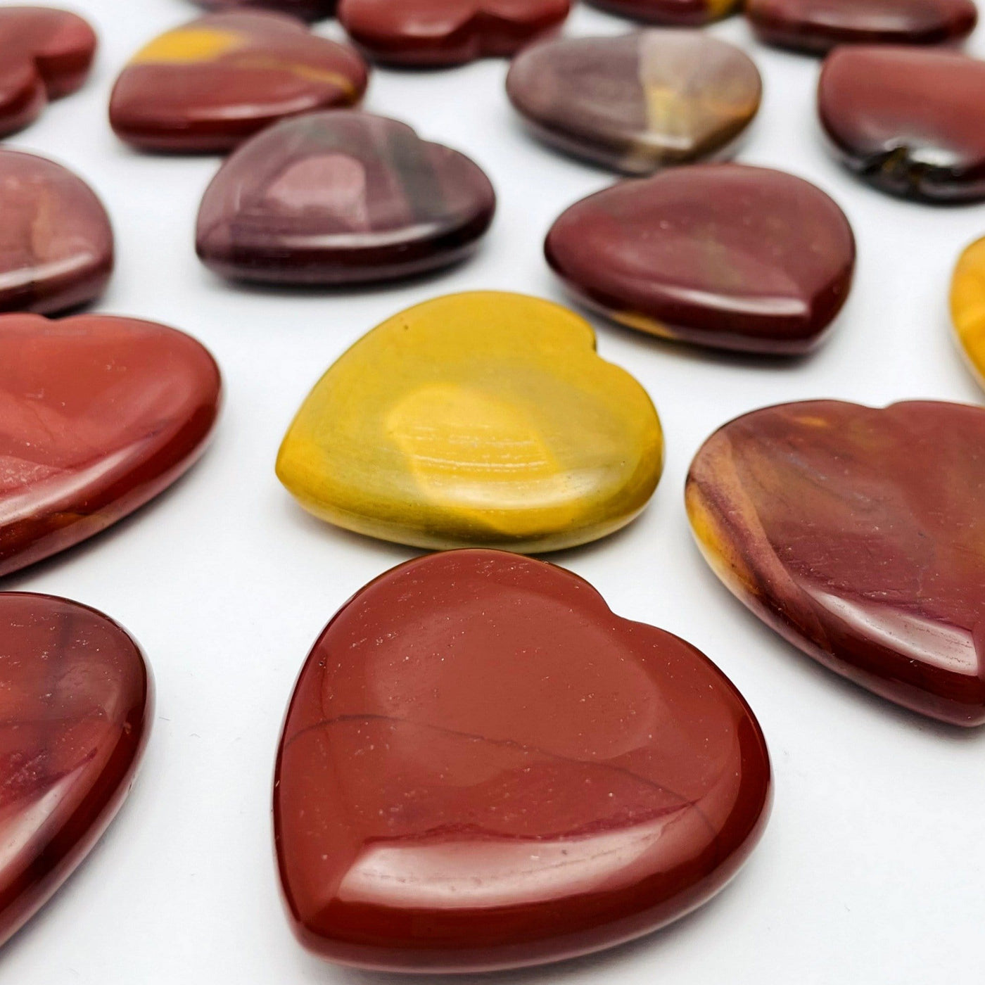 Mookaite Heart scattered on white background