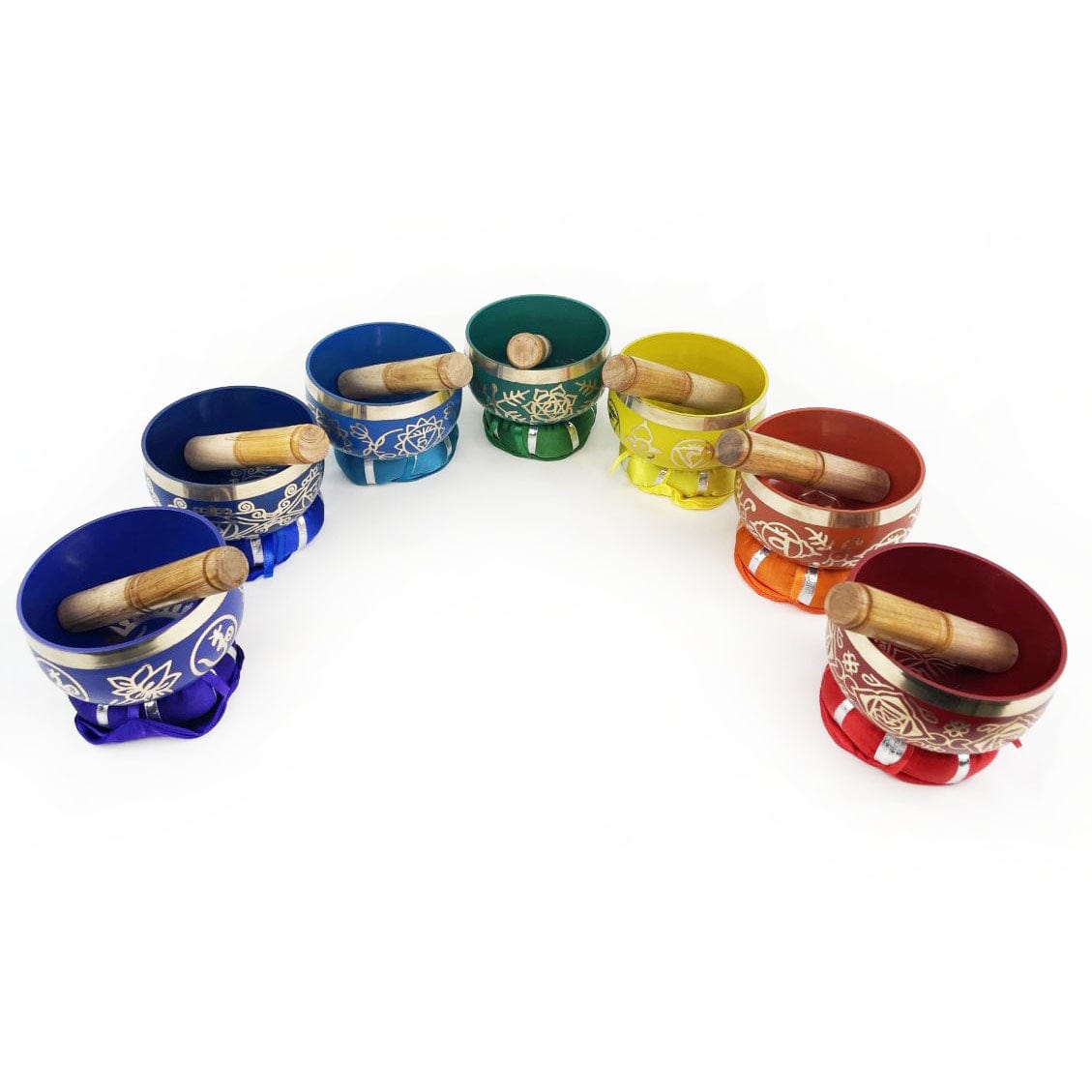 All 7 Chakra Singing bowls with mallets in a semi circle.