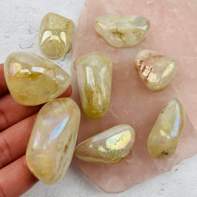 citrine titanium treated stone in hand for size reference 
