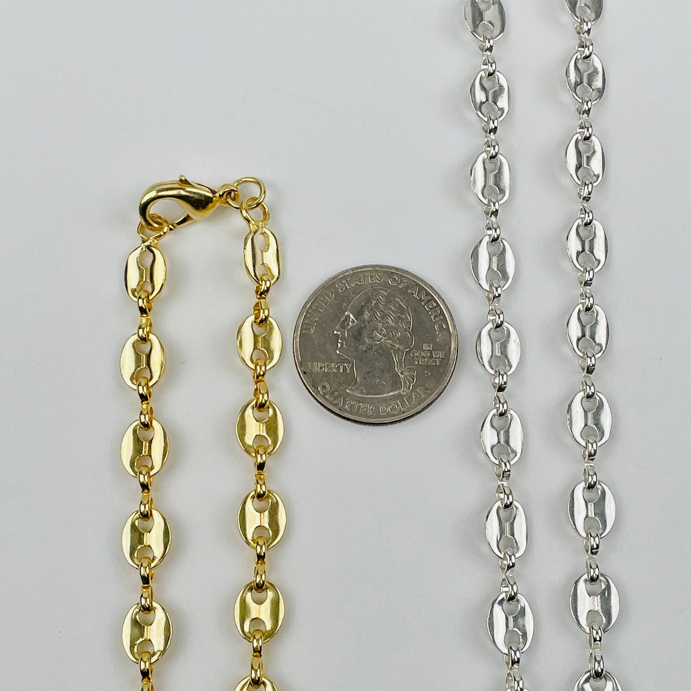 necklace next to a quarter for size reference 