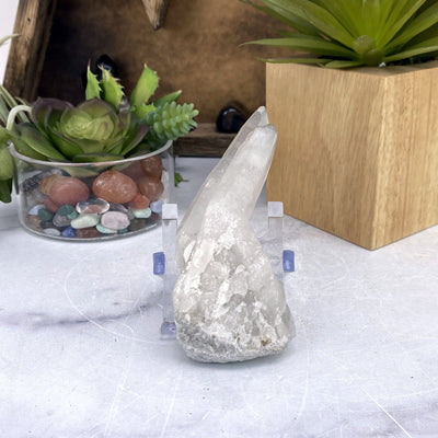 Crystal Quartz Cluster with decorations in the background