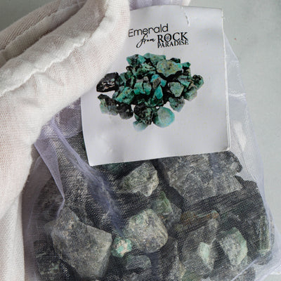 Emerald Stones - Tied & Tagged in an Organza Bag in a hand up close