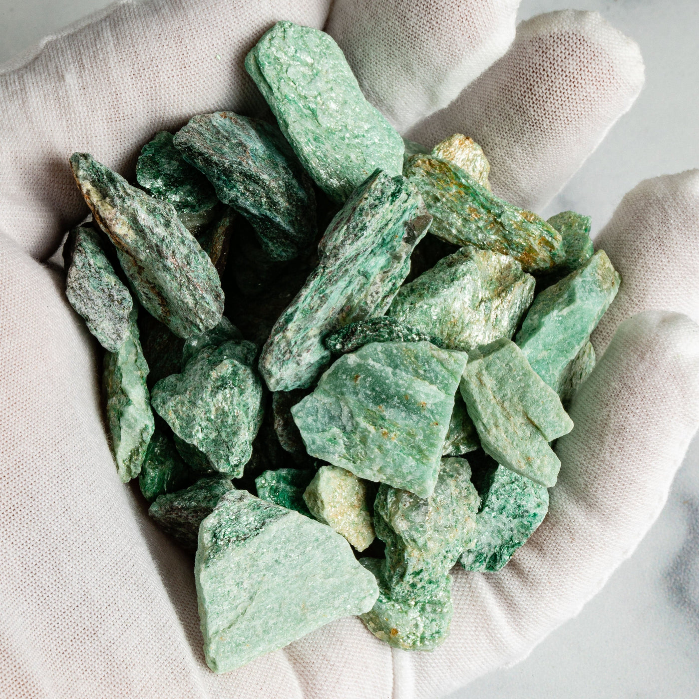 Fuchsite Stones in a hand up close